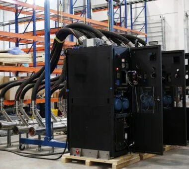 CoolIT CDU system installed in an industrial environment with connected coolant piping