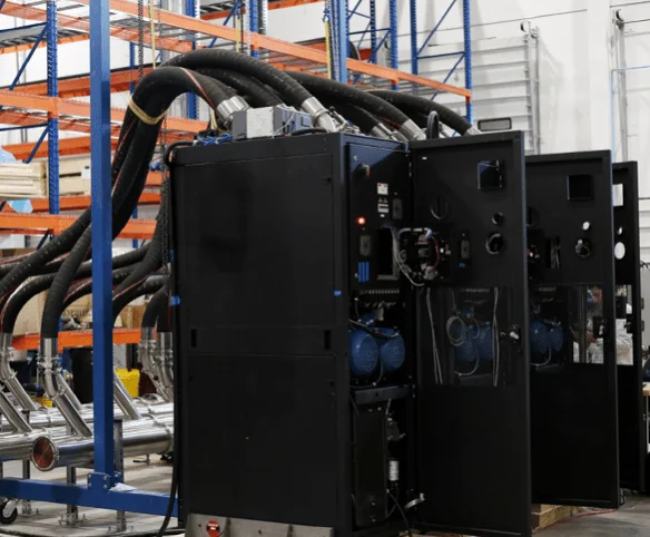 CoolIT CDU system installed in an industrial environment with connected coolant piping