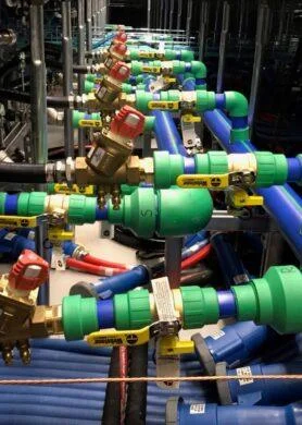 Prefabricated liquid cooling piping manifold with valves and supply-return lines for high-density data centre deployment.