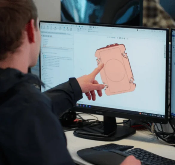 Engineering team designing advanced thermal management solutions and coldplates for AI data centers using CAD software and thermal simulation.