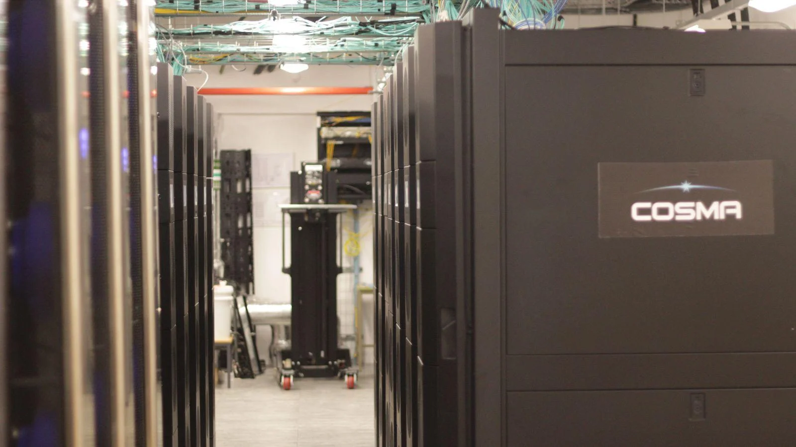 A promotional "Meet and Greet" graphic for the Open Compute Project, featuring professional portraits of three team members: Cam Turner, Peggy Burroughs, and Calum Devlin.