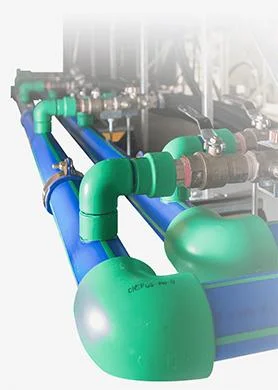 Green and blue liquid cooling pipe assembly with insulated return and supply lines inside a data center system.