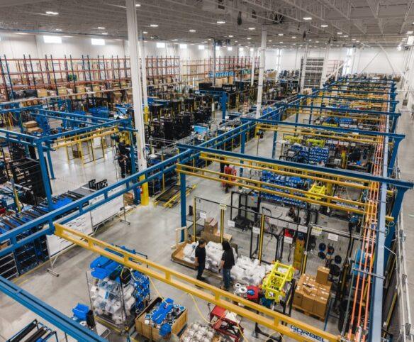 CoolIT Systems manufacturing site showing assembly lines and infrastructure for liquid cooling systems.