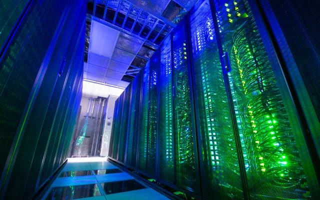 Expanse supercomputer cluster at San Diego Supercomputer Center with liquid cooling infrastructure.