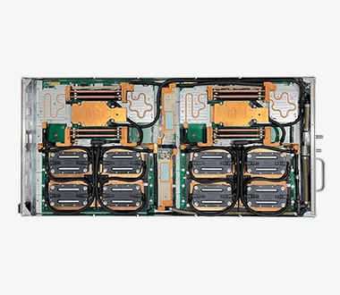 Top-down view of a dual-node liquid-cooled server showing copper cold plates, coolant tubing, and integrated direct liquid cooling architecture.