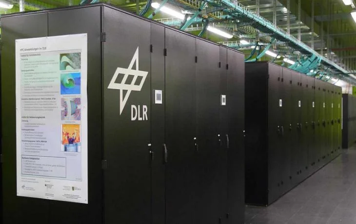 Data centre racks equipped with liquid cooling infrastructure supporting high-density HPC systems.