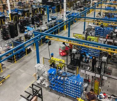 Large-scale manufacturing floor assembling coolant distribution units and liquid cooling systems.