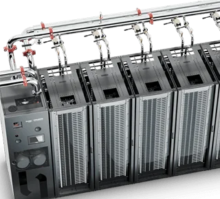 Rear view of liquid-cooled server rack with integrated coolant manifolds and piping