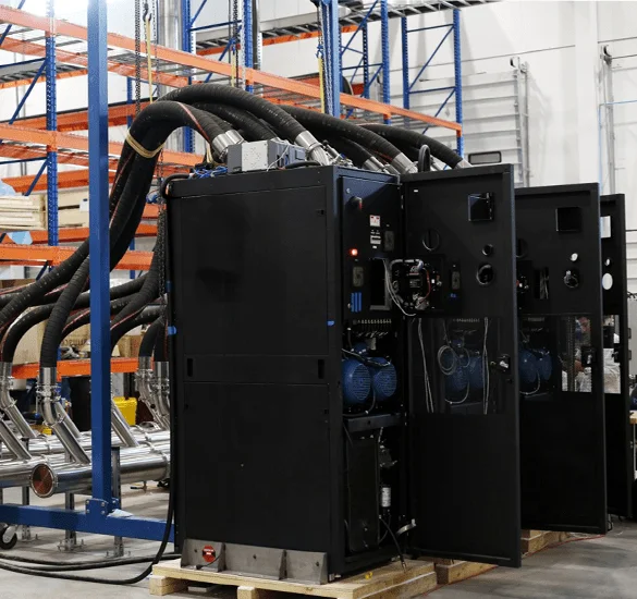 CoolIT CDU system installed in an industrial environment with connected coolant piping